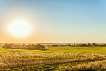 Rural landscape in light of the low evening sun backlight. Belgorod region, Russia.