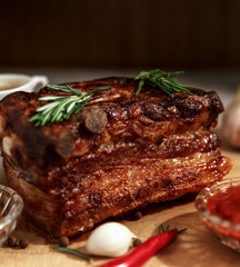 Tasty juicy grilled meat with vegetables and spices close-up