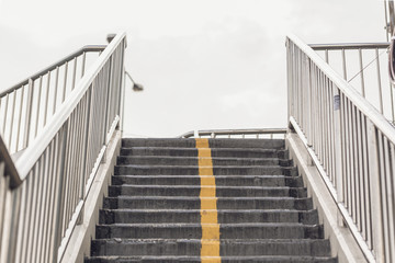 Selective focus look up view the stair with white sky, abstract minimal background.