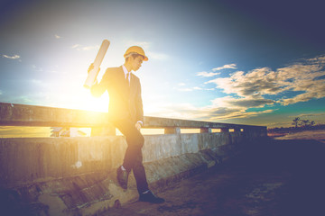 Fototapeta premium Young Engineer inspect dam reservoir. Business Industrial concept.