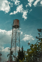 Water tank on a steel stand.