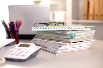 Points on the office desktop with a computer and documents