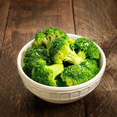 Cooked green broccoli with sea salt and copyspace