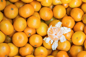 Fresh oranges from orchard on market for background.