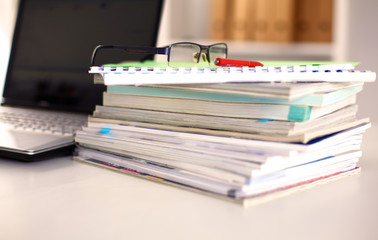 Points on the office desktop with a computer and documents