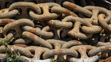 group of old rusty chain link detail macro. Old worn links of a thick nautical sailing chain