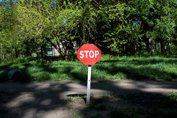 Stop sign close-up on a wooden pole. Protected area. Stop it. Attention.