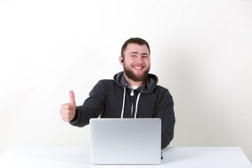 Businessman happy with work. He holds his thumb up. He smiles. Isolated one man on a white background.