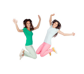 Fototapeta na wymiar Two happy excited young women jumping