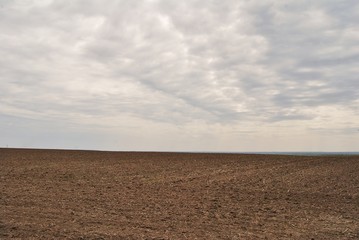 Fototapeta na wymiar Landscape plowed field