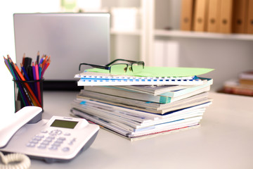 Points on the office desktop with a computer and documents