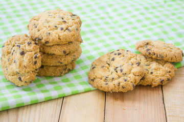 Chocolate chip cookies on wood table.