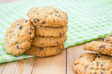 Chocolate chip cookies on wood table.