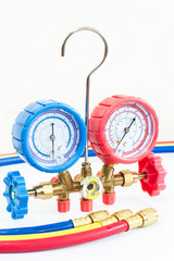 Manometers on equipment for investigate and refueling of air conditioners.