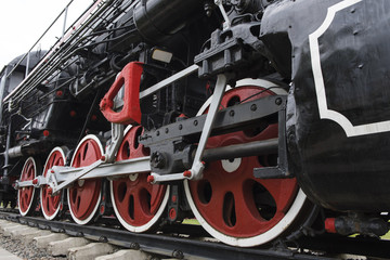 the wheels of a steam locomotive