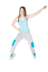 Young, pretty natural looking girl in sport t -shirt and jogging pants having fun dancing. Full body studio shot, pure white background.