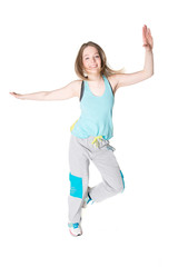 Young, pretty natural looking girl in sport t -shirt and jogging pants having fun dancing. Full body studio shot, pure white background.