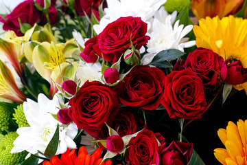 Bouquet with red roses, сhrysanthemums and gerberas