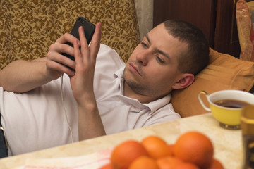 A young man with his smartphone