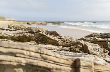 Rocks overlooking beach shore line.