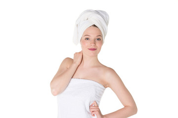 Young beautiful, pretty girl with towel. Ready for massage and skin cosmetic treatment. Studio portrait shot. Pure white background