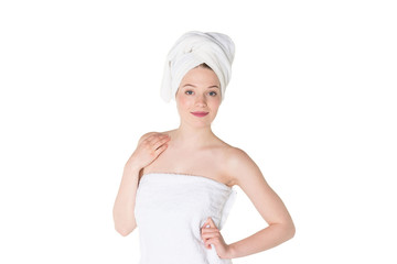 Young beautiful, pretty girl with towel. Ready for massage and skin cosmetic treatment. Studio portrait shot. Pure white background