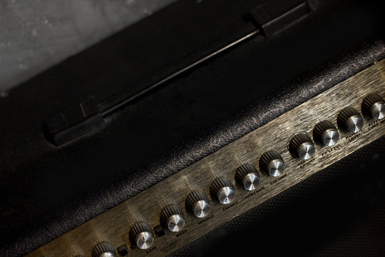 Guitar amplifier control in music studio.