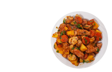 meat with mushrooms and vegetables. top view. isolated on white