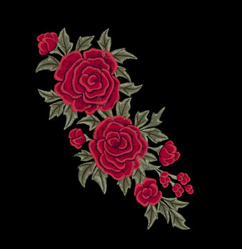 Red roses and green leaves. Embroidered flowers.