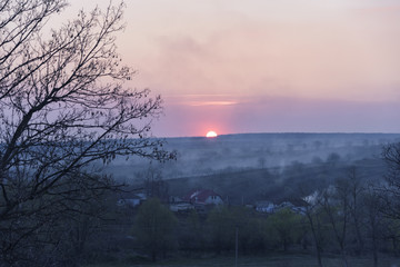 Beautiful sunset and haze in the village