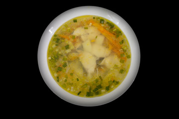 Fish soup on a black background
