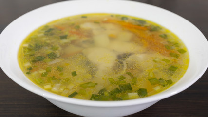 Fish soup in a white plate