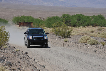 A high performance SUV being driven flat out on a track in Death Valley, America.