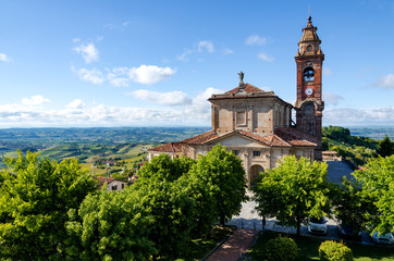 Fototapeta na wymiar Main square of Diano d'Alba (Piedmont, Italy), town in the hills of Langhe, with the gardens and the church of San Giovanni