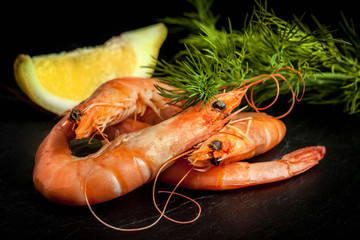 Shrimps for dinner on stone plate.