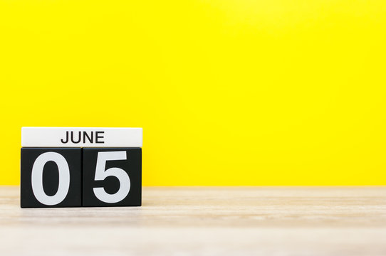 June 5th. Day 5 of month, calendar on yellow background. Summer day, empty space for text. International Cleanup Day