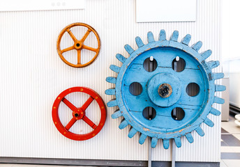 Color Wooden cogwheel gears on the wall