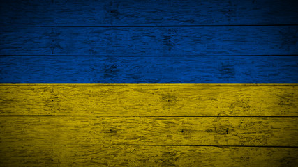 Flag of Ukraine on old wood boards