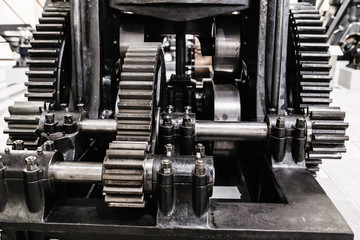 Flywheel gear in industrial machine closeup