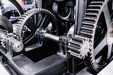 Flywheel gear in industrial machine closeup
