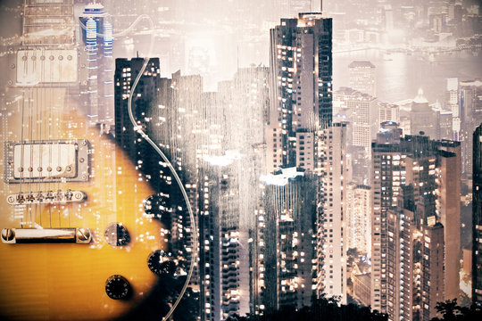 Creative guitar on city background