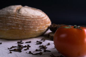 Fresh tomatoes, homemade bread and cloves.