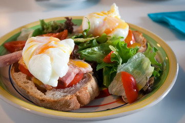 Breakfast with eggs Benedict , toasted ham, poached eggs.