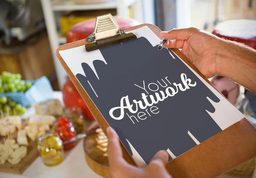 Hands Holding a Clipboard and Pen Mockup