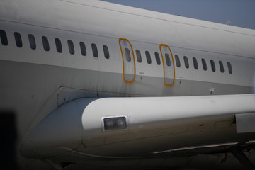 Part of a wing and a fuselage of a big passenger airplane