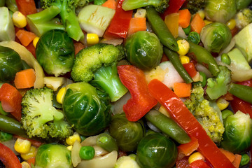 Fresh vegetables are stewed for dietary nutrition. Broccoli cabbage, Brussels, zucchini, corn, peas, onion, green beans, carrots, Bulgarian pepper