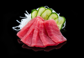 Tuna sashimi over black background, - obrazy, fototapety, plakaty