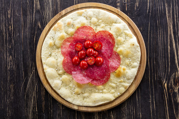 Focaccia with salami and cherry tomatoes