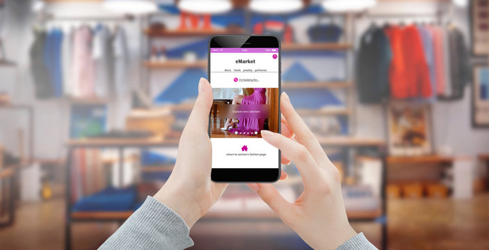 Girl shopping online on smartphone in fashion store