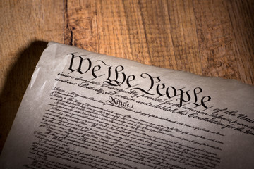 United States Constitution on a Wooden Background